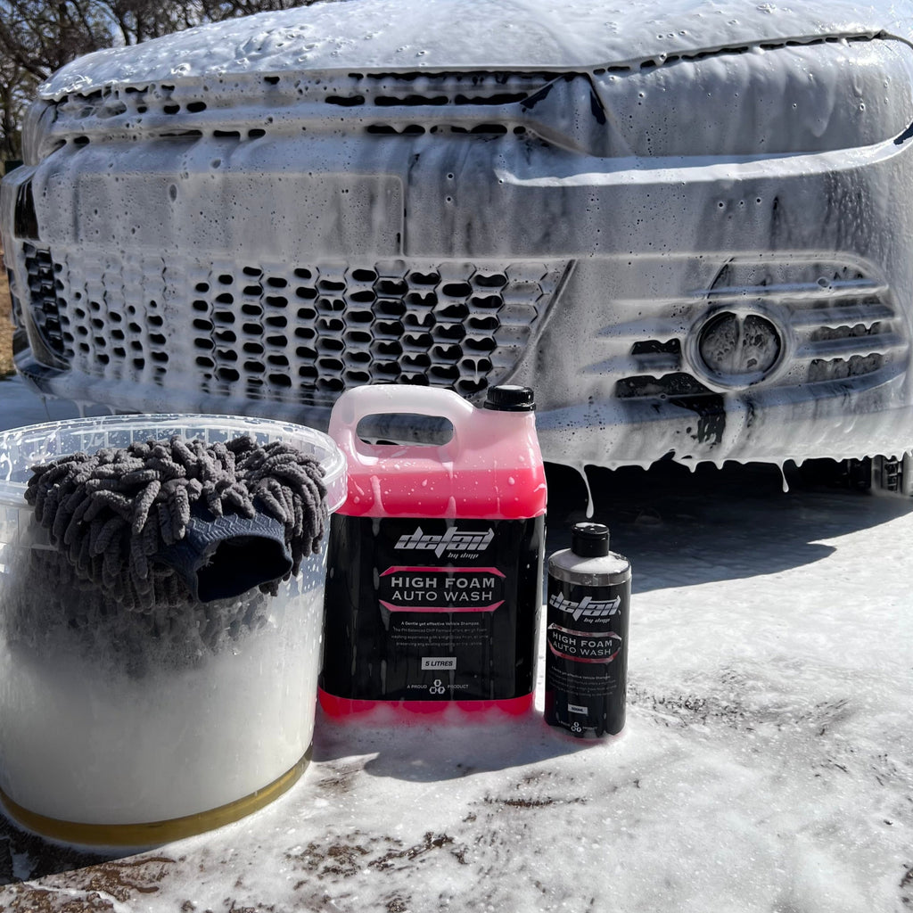 High Foam Wash and Wax 500ml and 5 litre, front of car, with bucket filled with thick foam and wash mitt