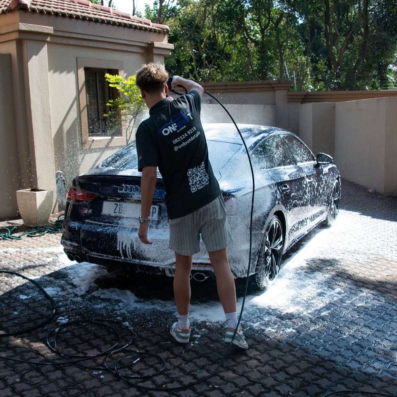 on foot detailing spraying foam